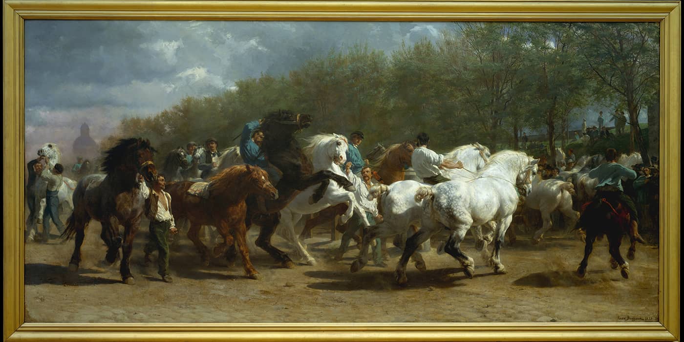 A parade of men on horseback