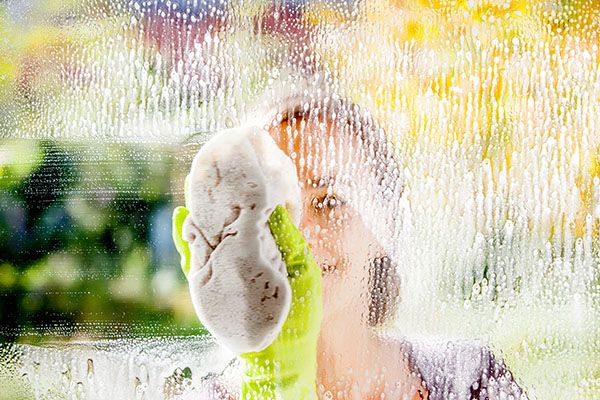 Woman cleaning a window